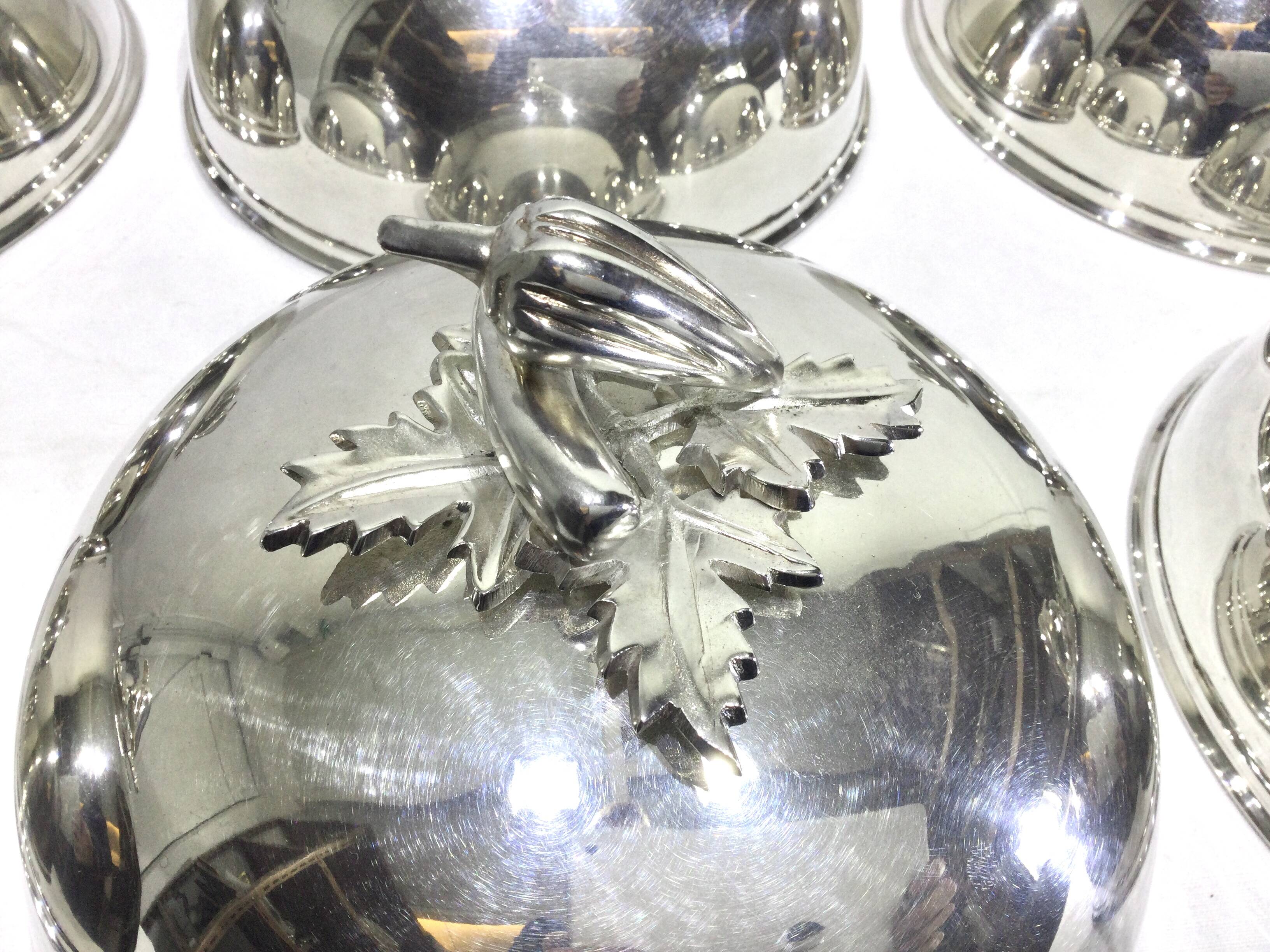 Set of silver-plated serving dishes and bells