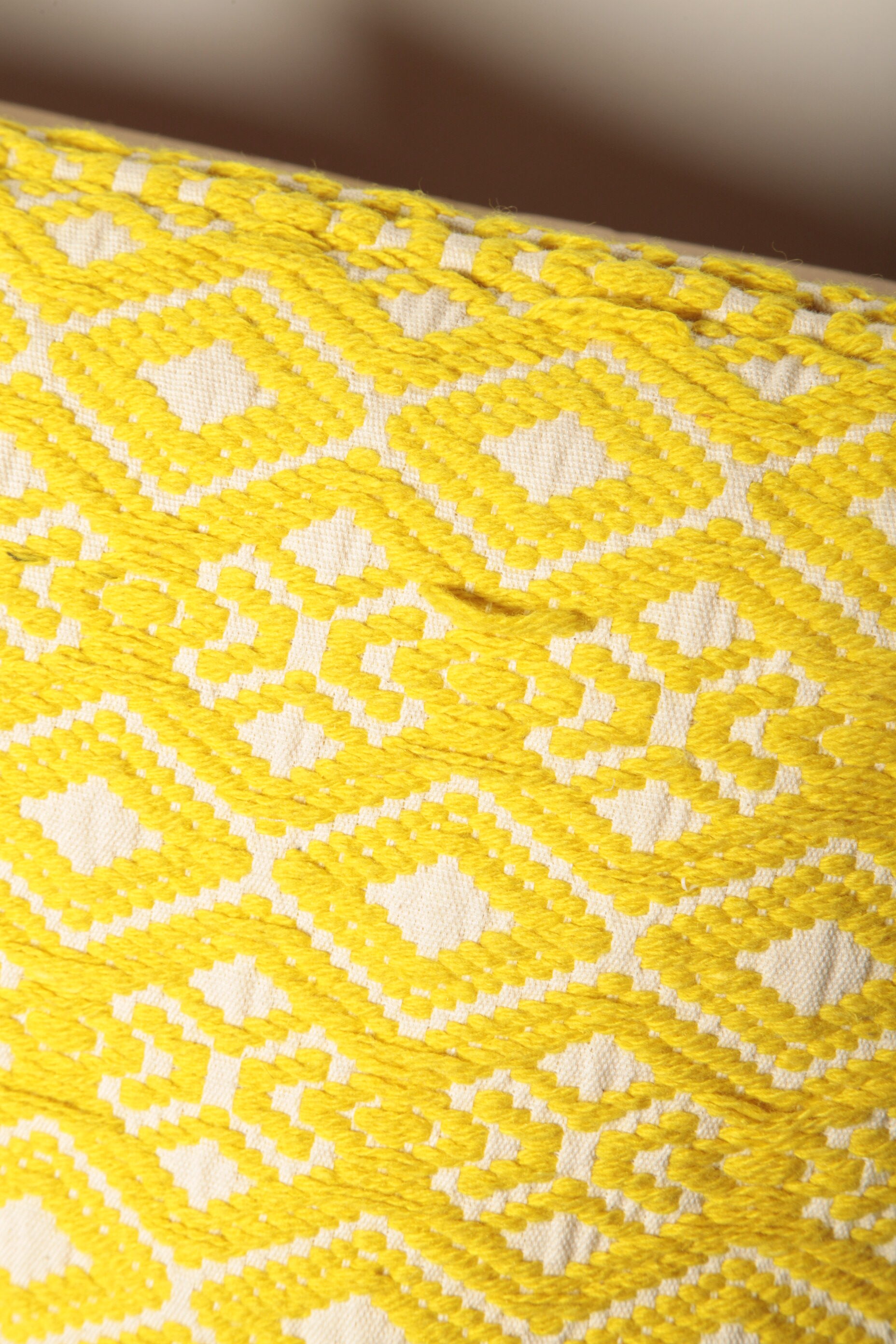 Yellow diamond knit cushion
