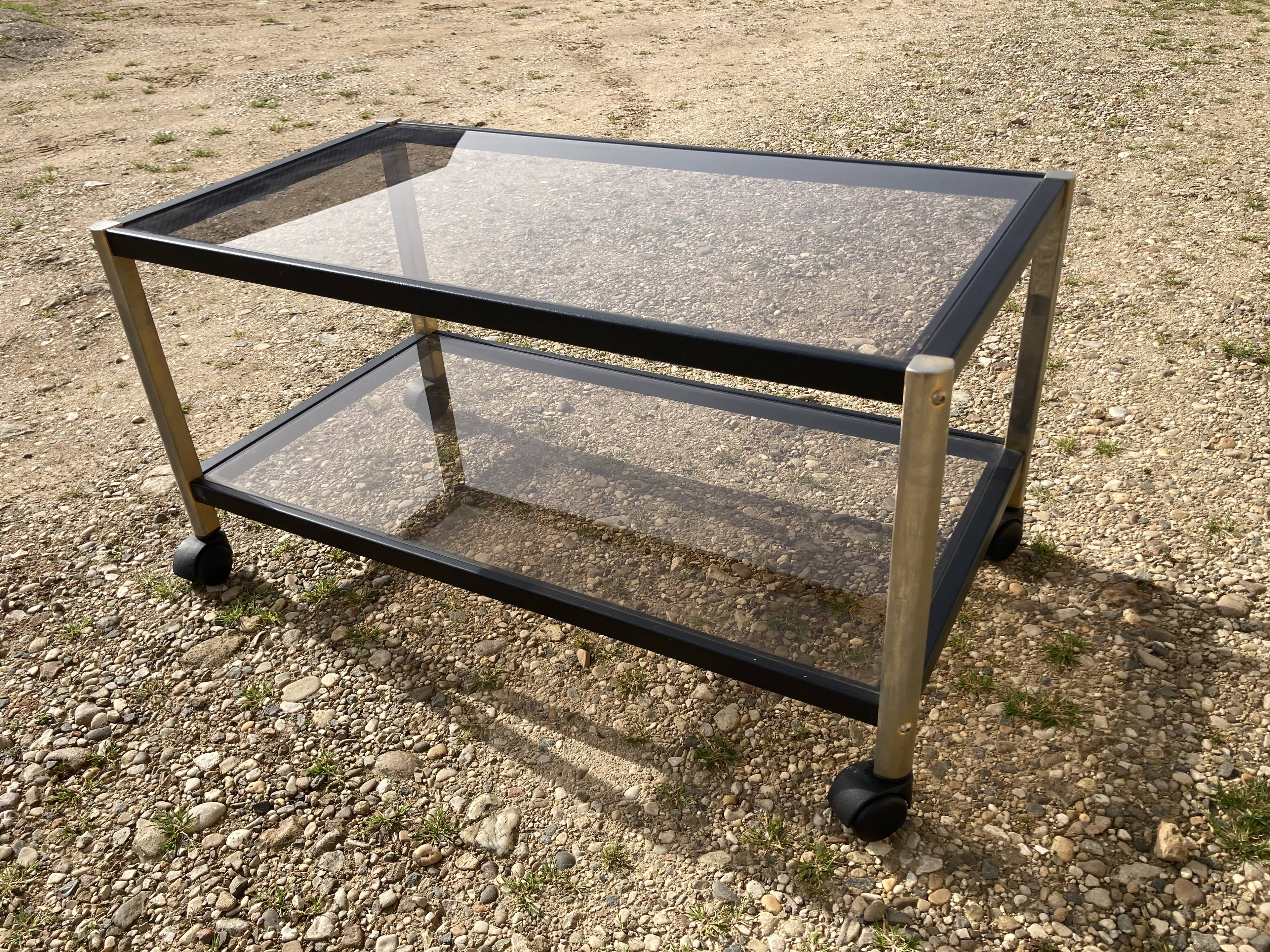 Glass coffee table on wheels