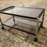 Glass coffee table on wheels