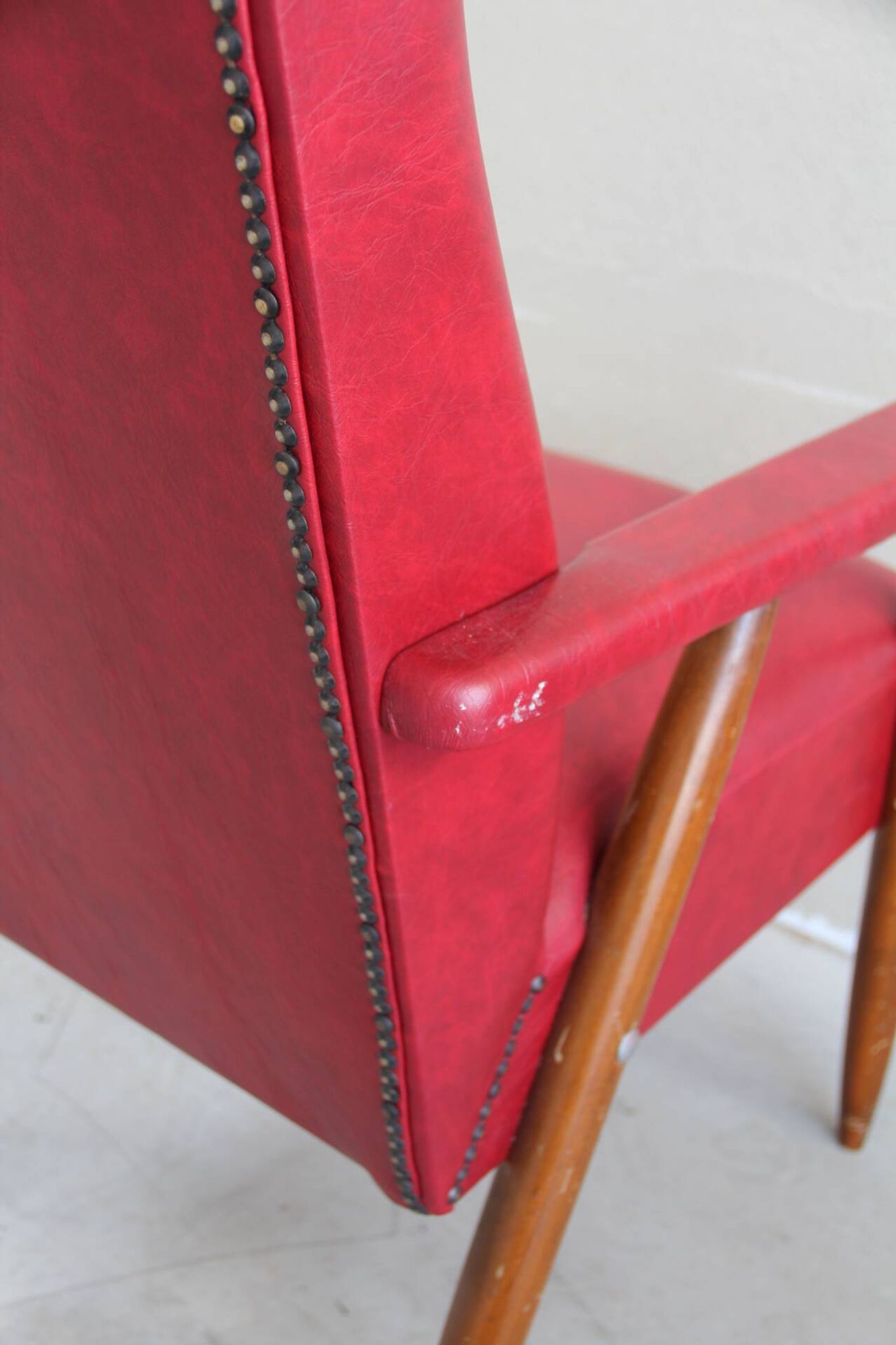 Vintage armchair in red leatherette