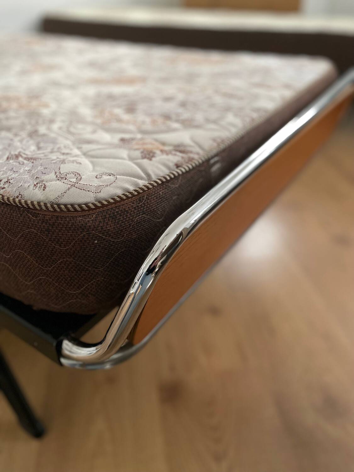 Pair of teak and chrome beds with mattress