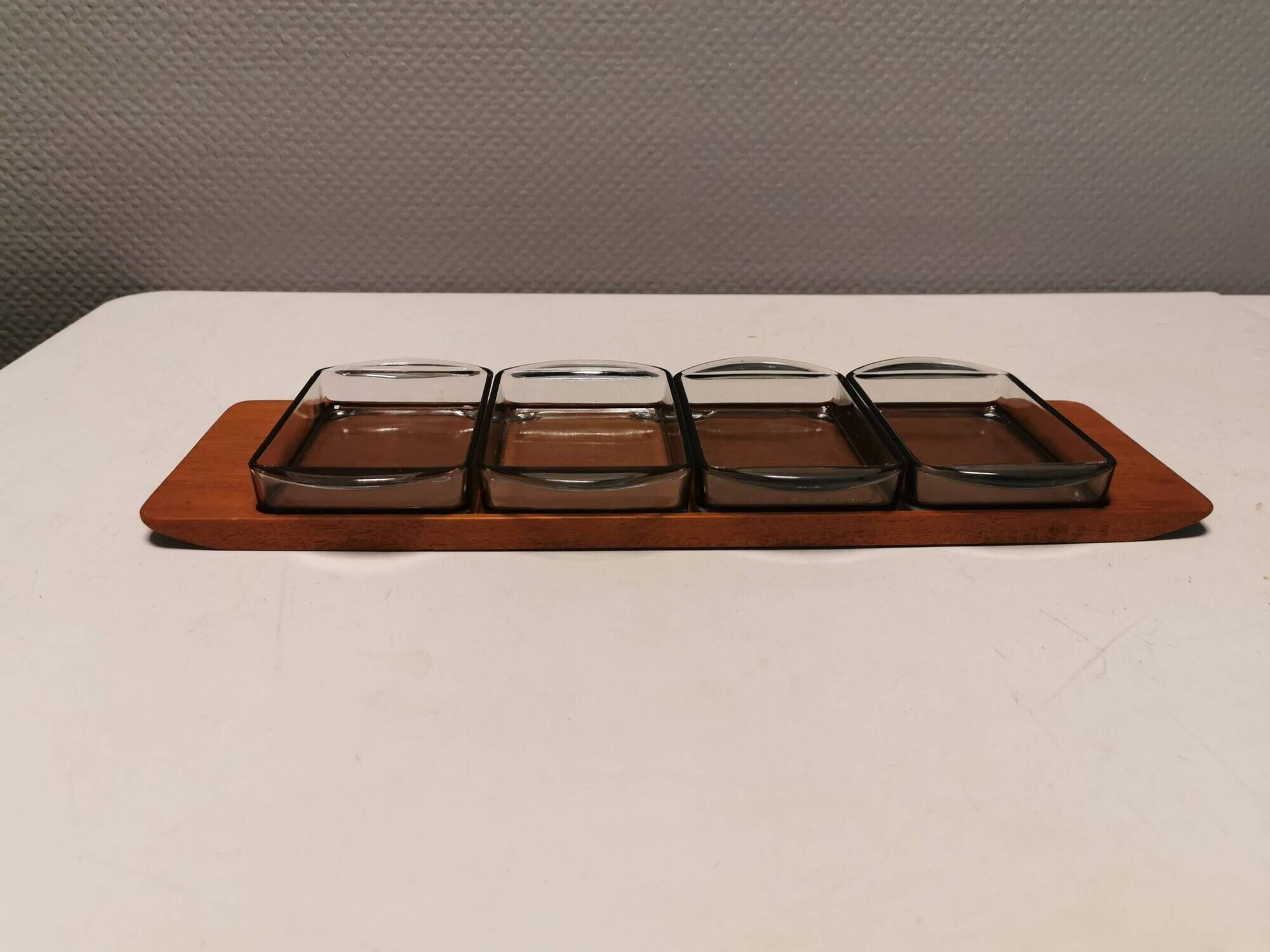 Teak Cabaret tray with four smoke coloured glass bowls, Danish and produced by Wiggers 1970s.