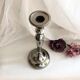 Chromed metal candle holder