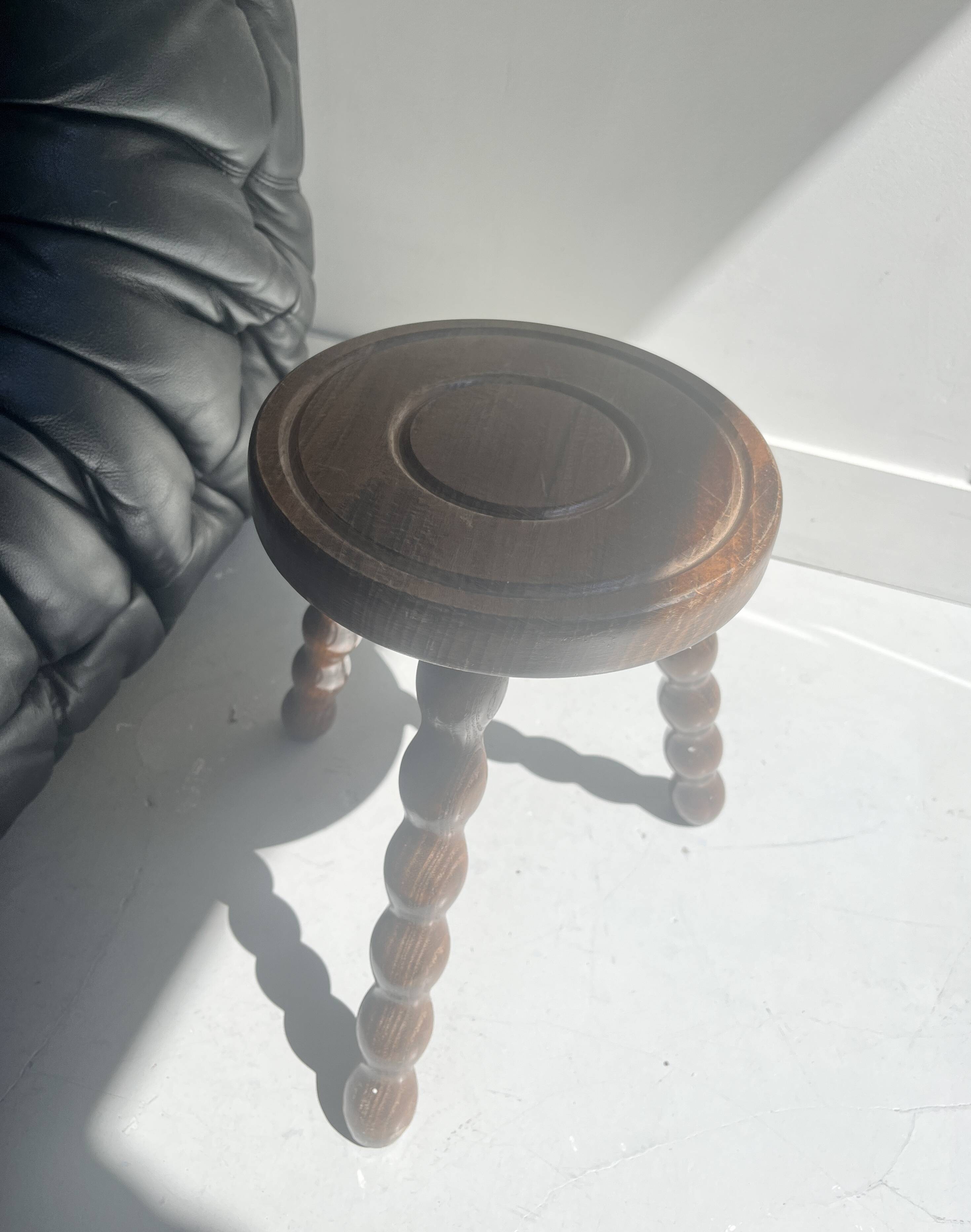 low tripod stool in turned wood, France 1960