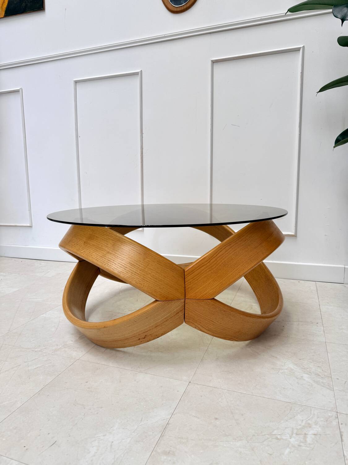 Smoked glass and curved wood coffee table