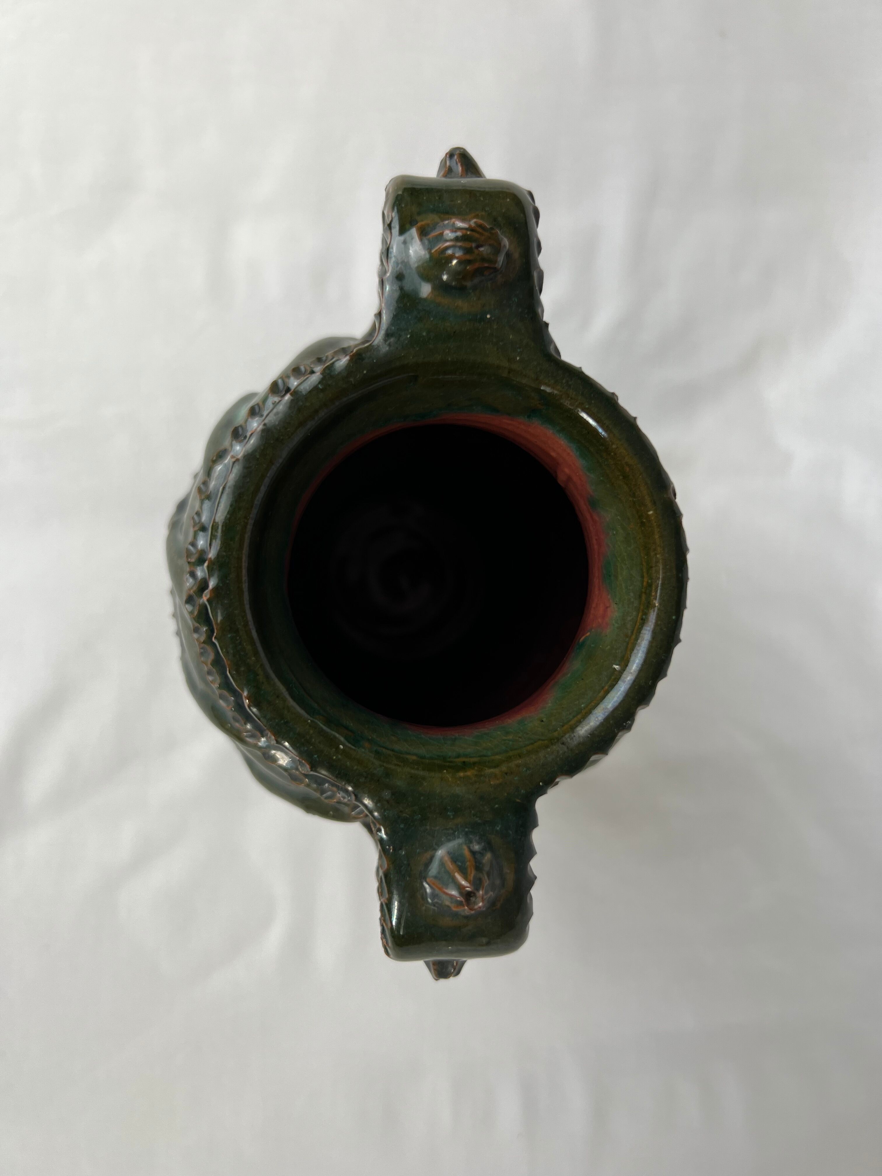 Terracotta jar with dark green handles