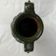 Terracotta jar with dark green handles