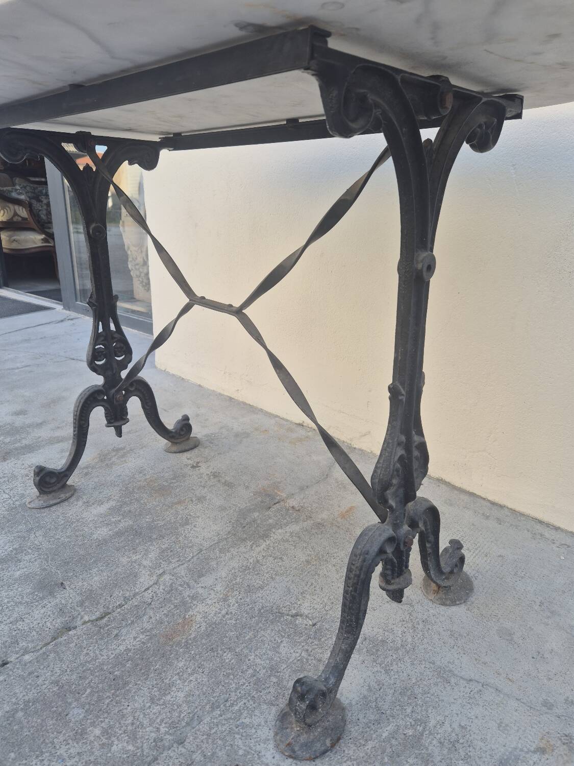 Antique cast iron and marble bistro restaurant table