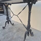 Antique cast iron and marble bistro restaurant table