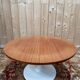 Round dining table with tulip base, 1960s design.