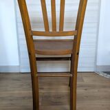 Antique patinated wooden bistro chair from the early 20th century.