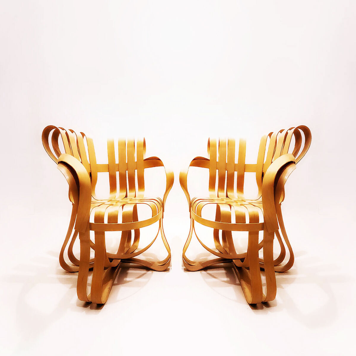 Frank Gehry dinette with 2 bentwood Cross Check chairs and a Face Off dining table for Knoll Inc.