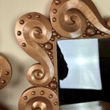 According to the model “the waves” by Jean Boggio: pair of designer gold mirrors circa 1980