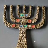 Menorah/Candlestick with 7 light arms. In old gold patinated brass/Decor 12 astrological signs. Engraved Jerusalem. Height 14 cm