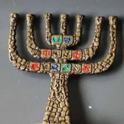 Menorah/Candlestick with 7 light arms. In old gold patinated brass/Decor 12 astrological signs. Engraved Jerusalem. Height 14 cm