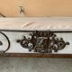 Wrought iron bed with mattress and decorative cover