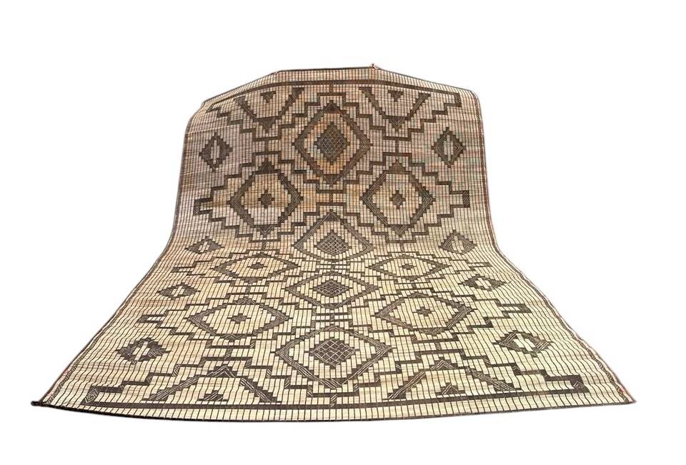 Vintage Touareg mat made of leather and reeds.