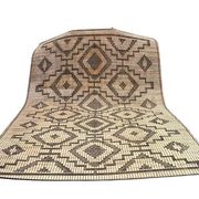 Vintage Touareg mat made of leather and reeds.