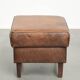 Sheepskin ottoman with a light brown colour scheme and a vintage look
