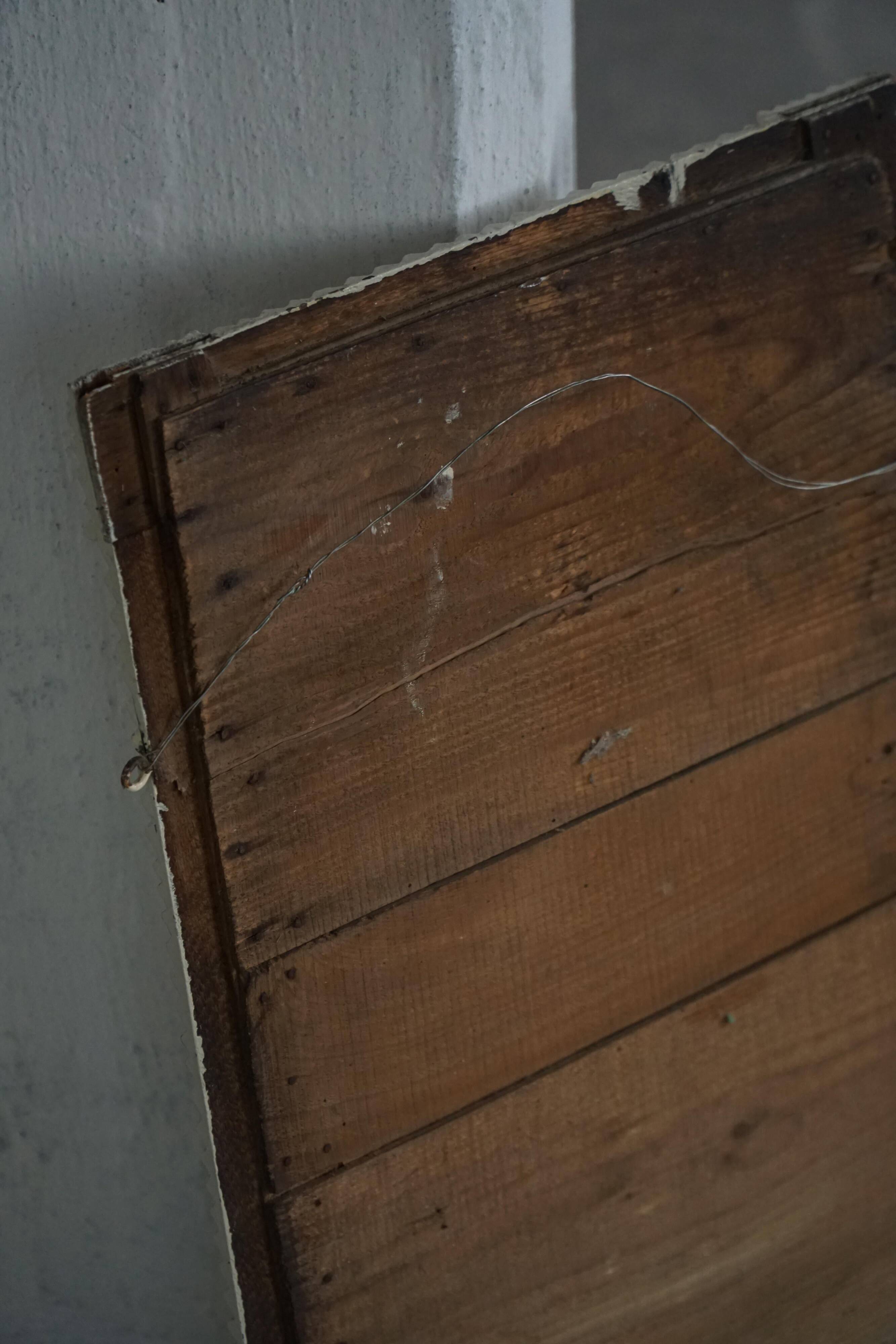 Wall mirror in tramp art style, hand-carved with a painted white frame, early 1900s.