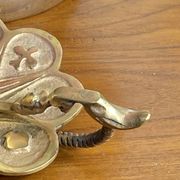 Handheld candlestick in bronze, card game decoration
