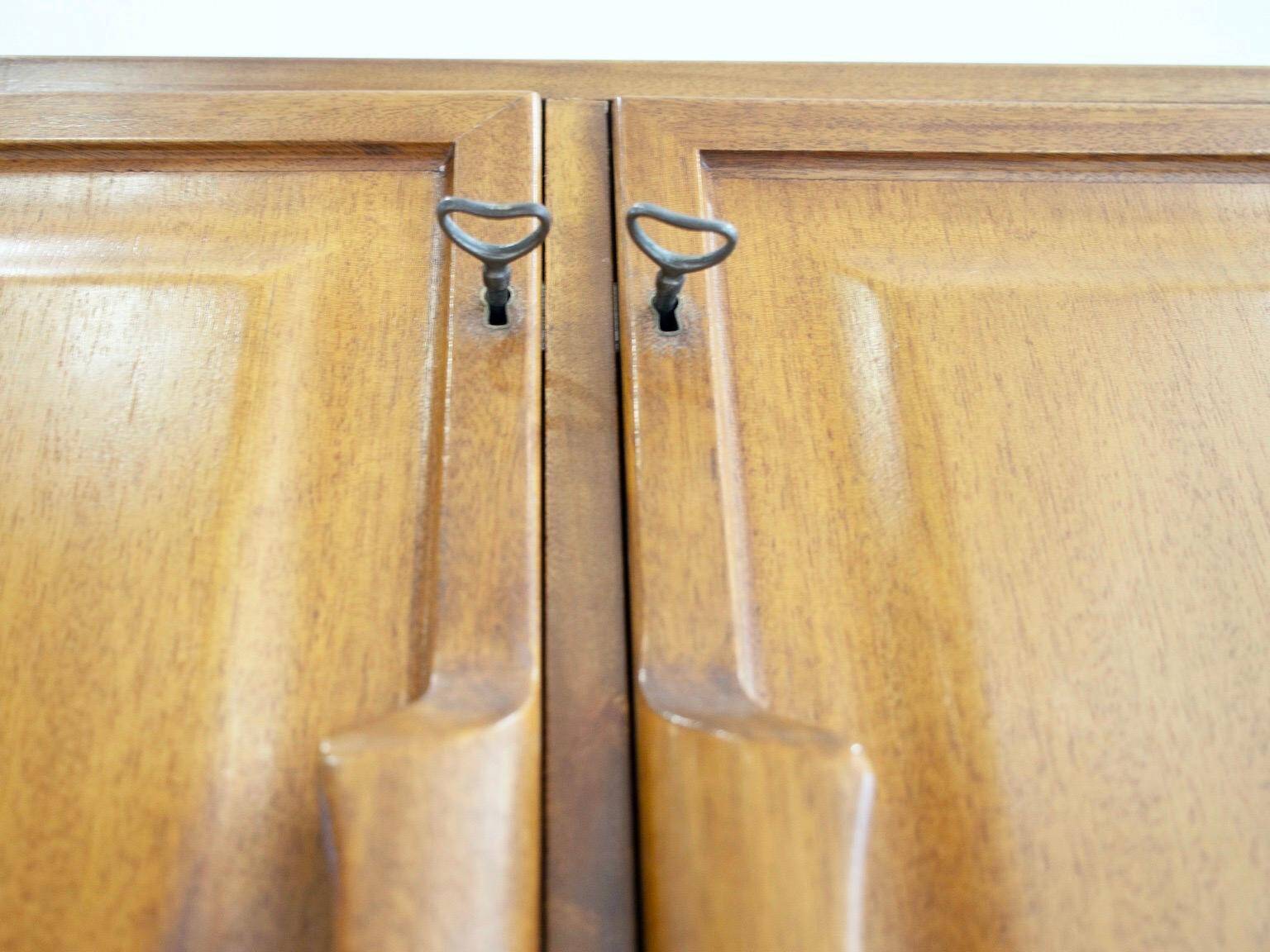 Large Swedish mahogany storage unit with four front doors.