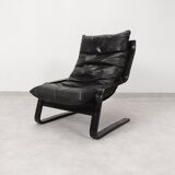 high-back scandianavian lounge chair in leather
