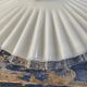 Suspension in electrified serrated white opaline to nine