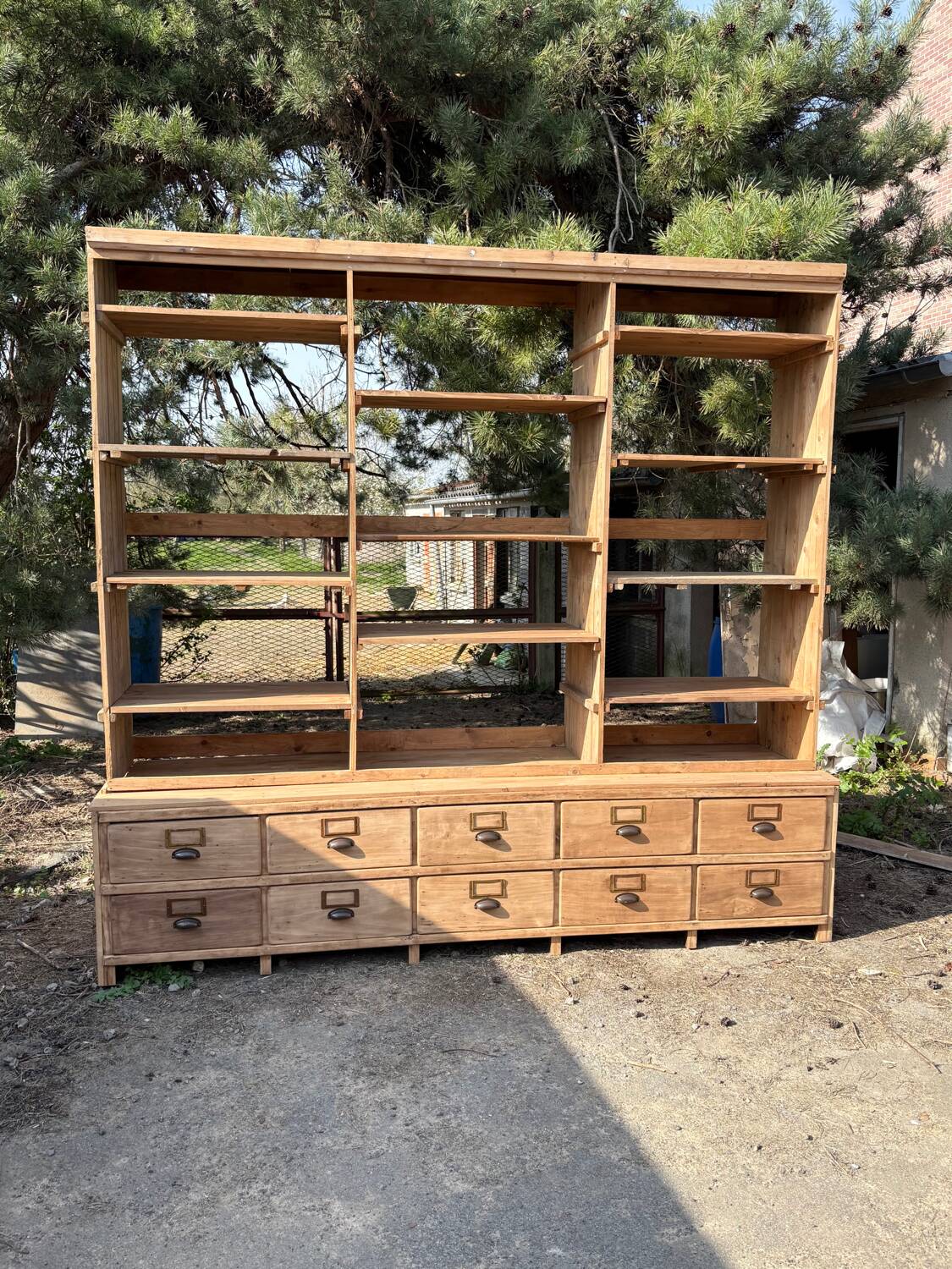 Large antique workshop furniture with drawers and shelves.