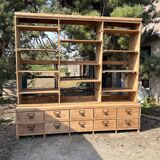 Large antique workshop furniture with drawers and shelves.