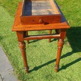 Antique solid wood table with a through drawer.