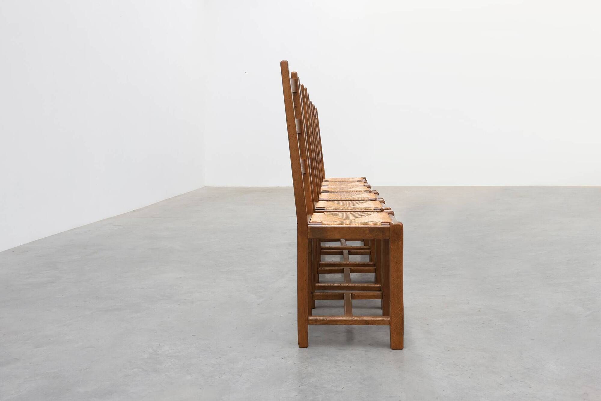 Set of 6 rustic oak ladder-back chairs with rush seats, France, 20th centur