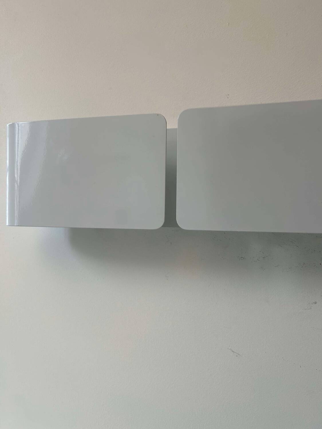 Pair of vintage wall lights, curved white metal, France 1980