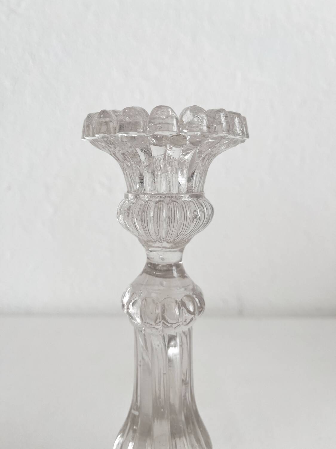 Antique baluster-shaped molded glass candlestick holder