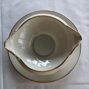 Sells sauceboat Elegant decoration of small golden roses,