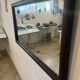 Large vintage mirror with a carved solid wood frame.