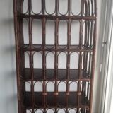 Library shelves in dark rattan