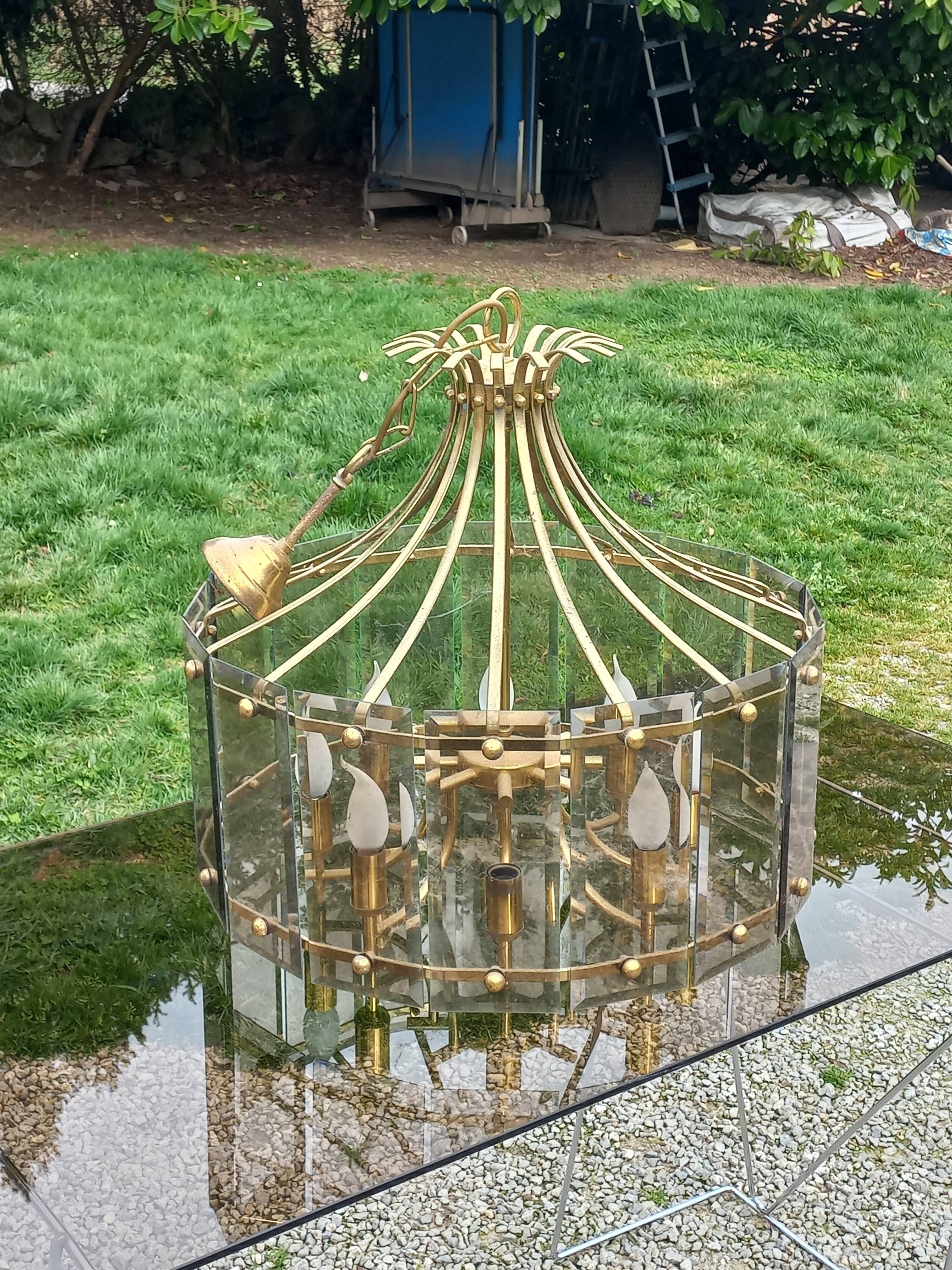 70s designer chandelier with smoked glass plates and gold metal frame