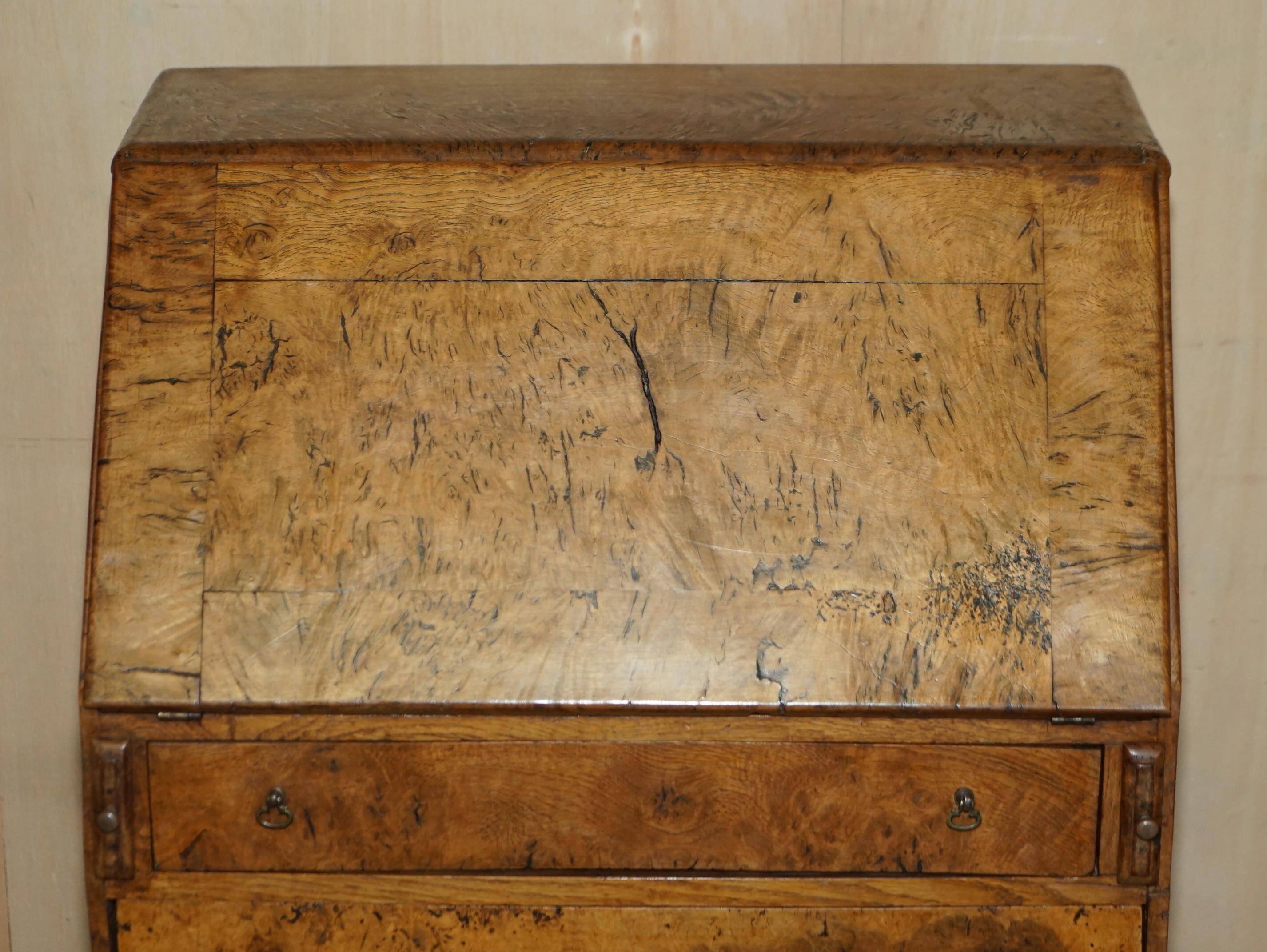 Writing desk in pollard oak from around 1800 with claw and ball carved legs.