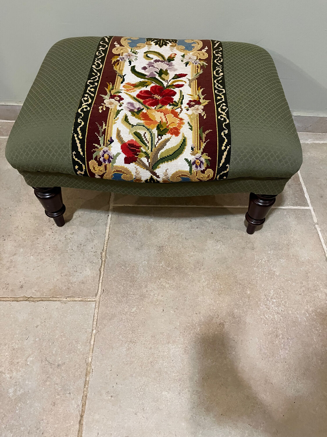 Vintage upholstered footstool, floral decor in Aubusson style.