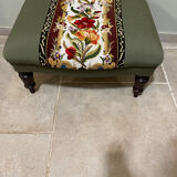 Vintage upholstered footstool, floral decor in Aubusson style.