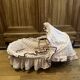 1960s wicker cradle with mattress and drapes.