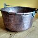 large copper and bronze cauldron