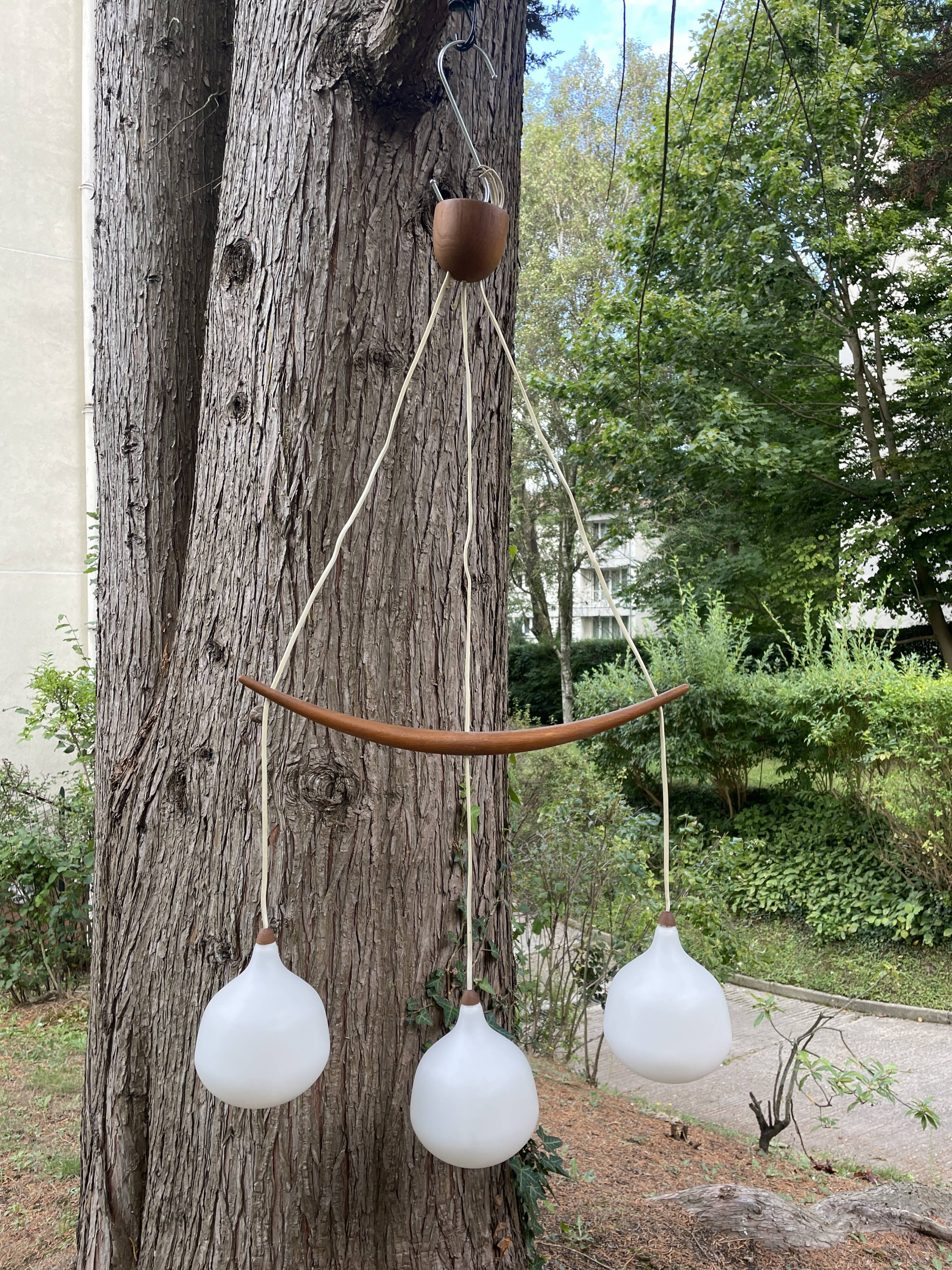 Scandinavian triple pendant light in Opaline and oak by Uno & Östen Kristiansson.