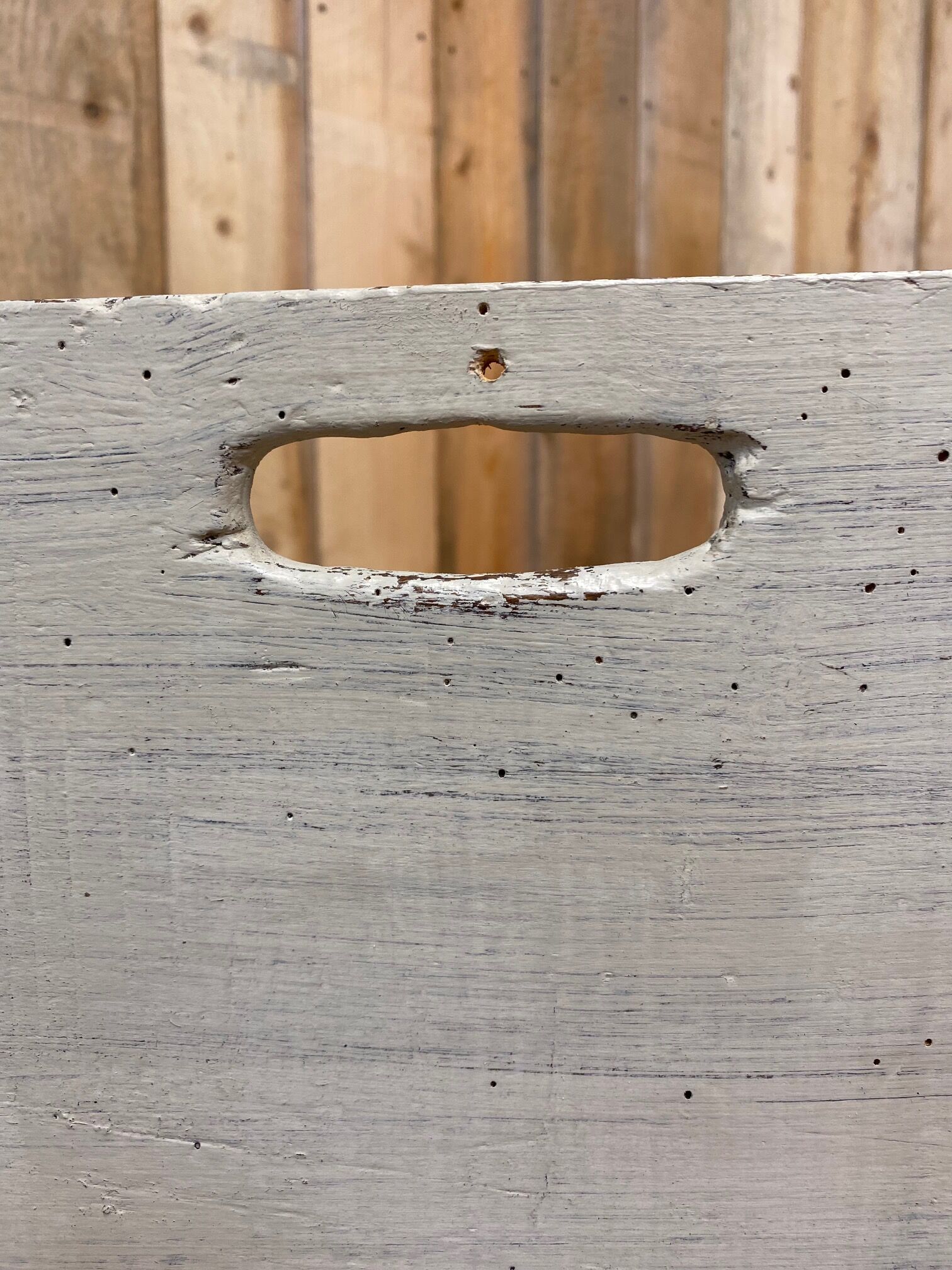 Old patinated washerwoman tray and its beater
