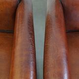 Vintage set of 4 sheepskin leather dining chairs on castors