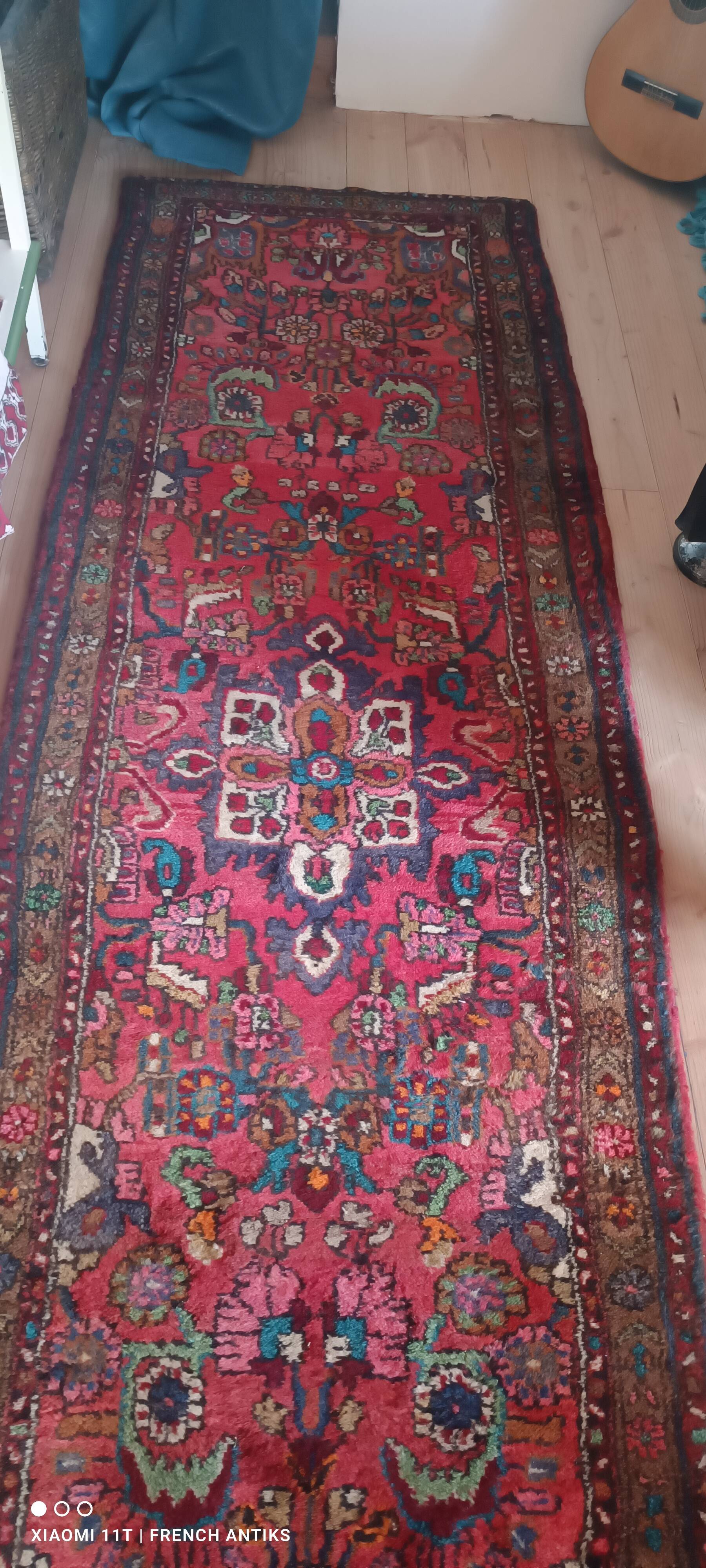 Vintage oriental rug from the 1930s. Handcrafted, handmade. Worn.