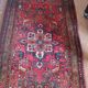 Vintage oriental rug from the 1930s. Handcrafted, handmade. Worn.