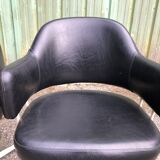 Pair of vintage armchairs in black skai with metal legs.